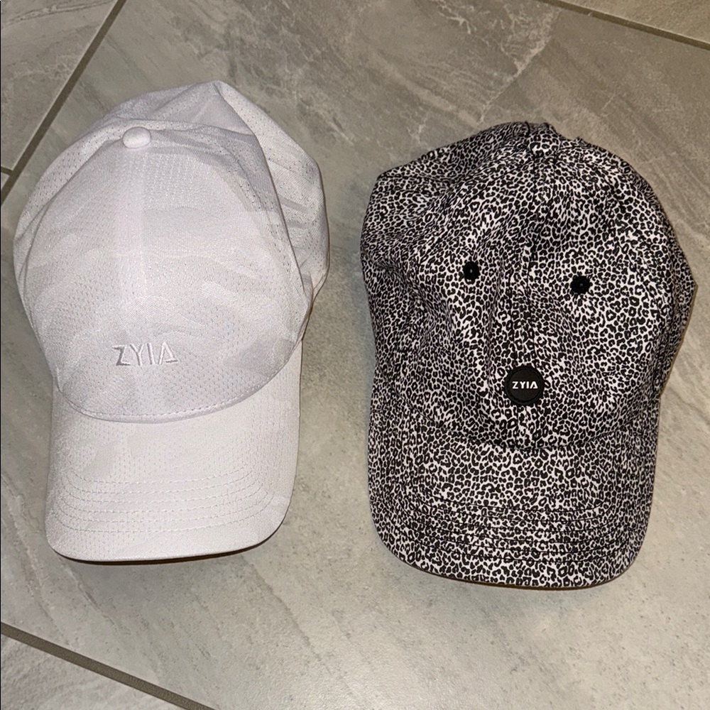 Two Zyia Hats- One White Camo and One Leopard Print